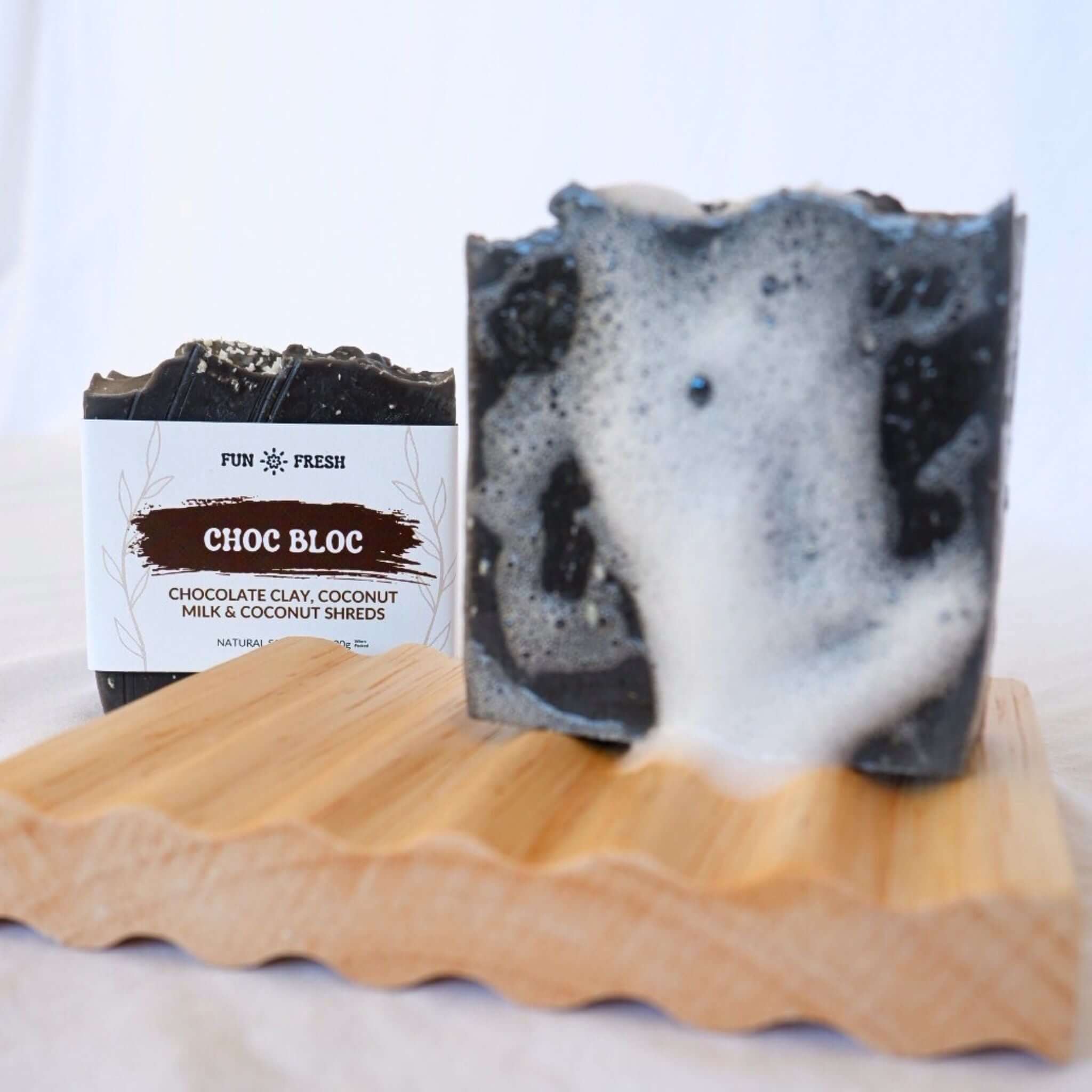 Choc Bloc soap bar on wooden soap holder